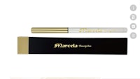 a white and gold eyeliner with a gold box